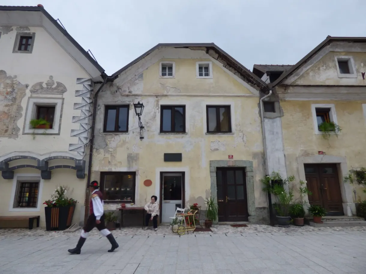 Old houses with painted facades lining the square