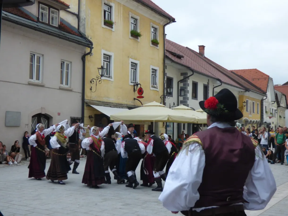 Dancers in traditional costume on the village square