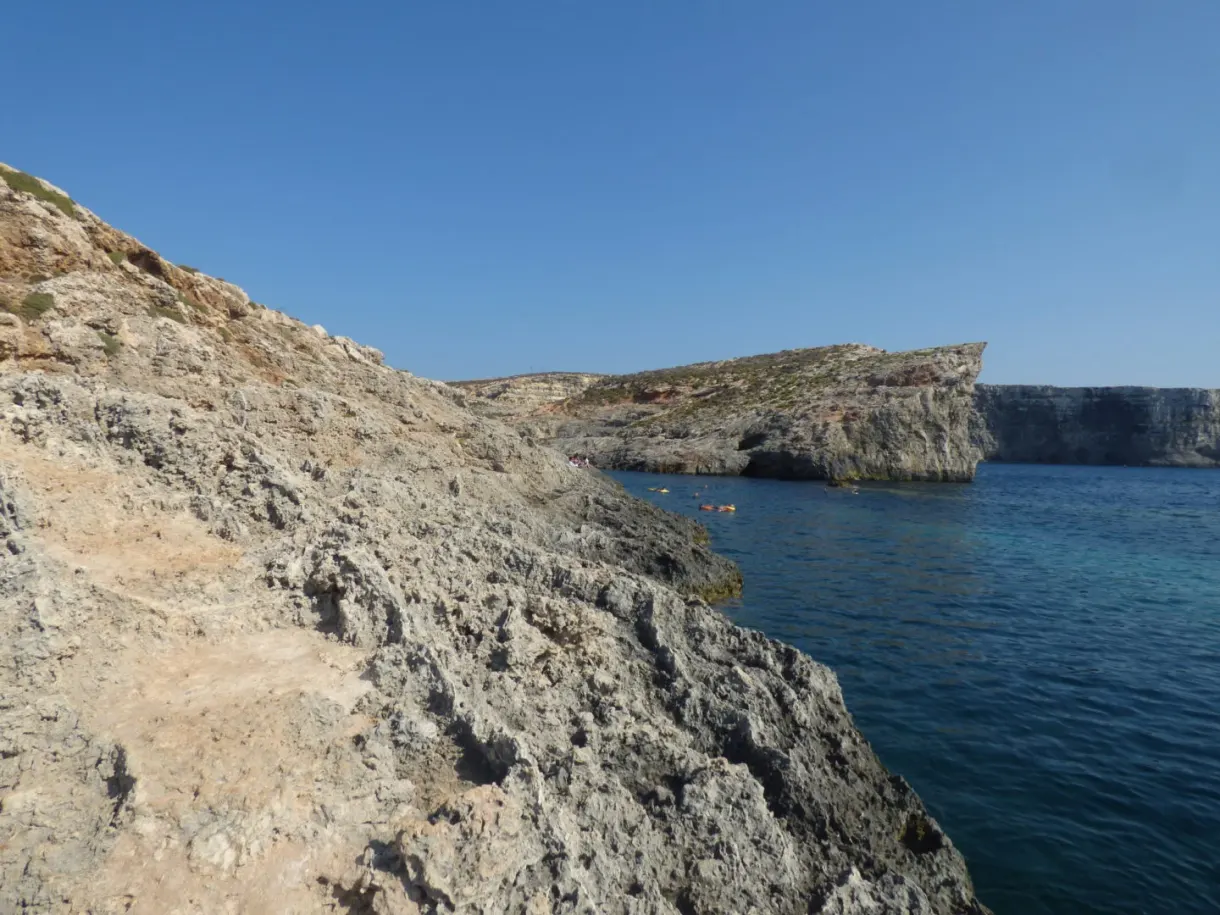 Steep rocky spur plunging into the sea
