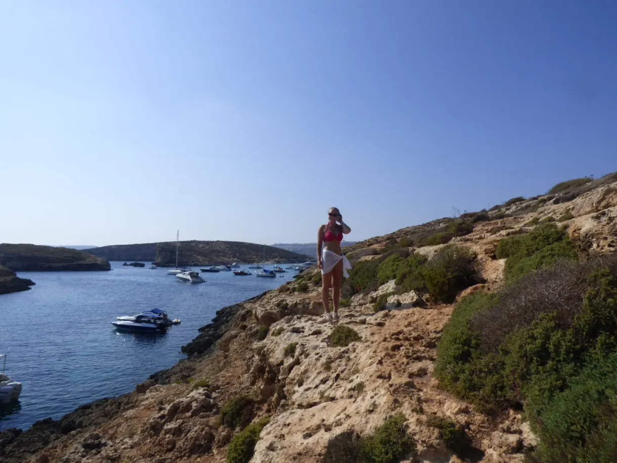 Woman standing on a rock above the anchorage
