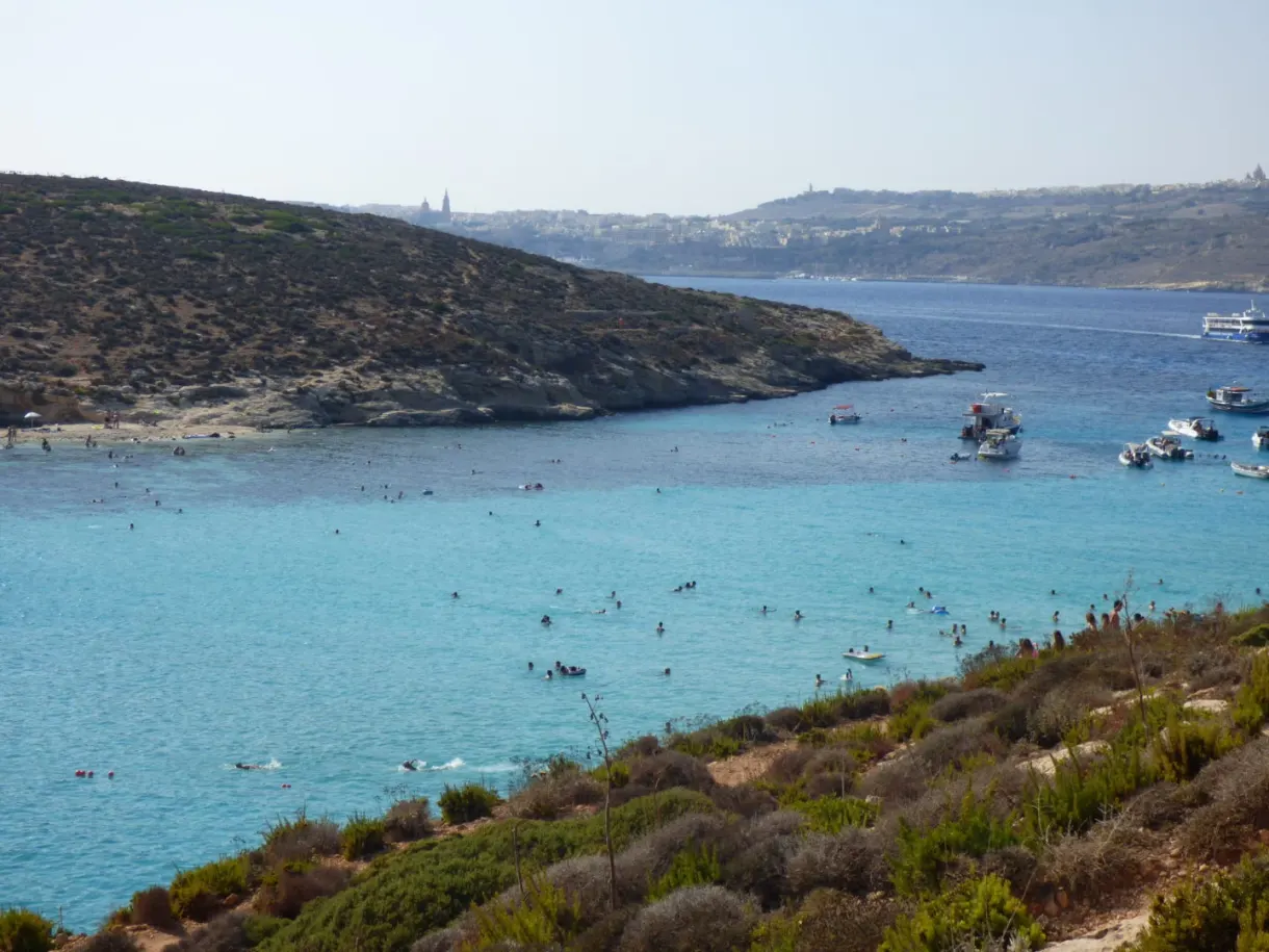 Swimmers scattered across the shallow water of the lagoon