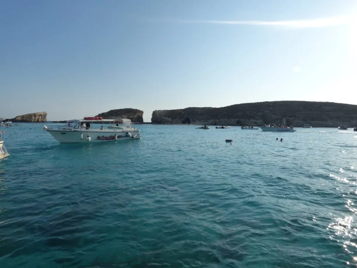Excursion boat against the light on the lagoon