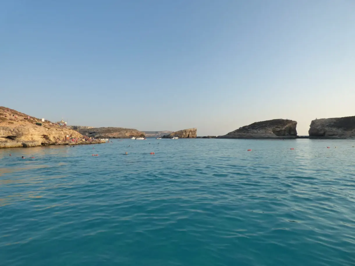 Rocky islet and milky water at the end of the day