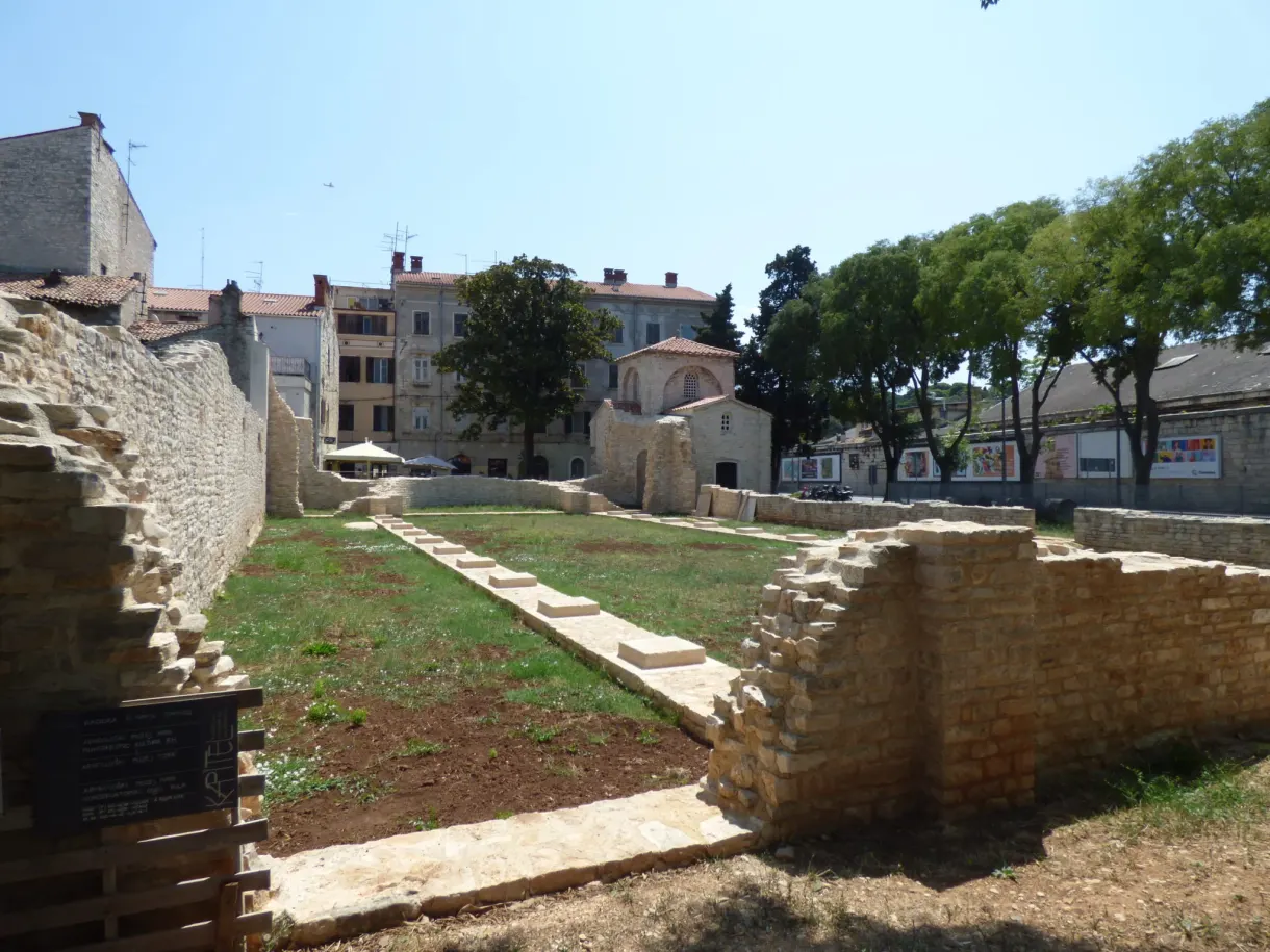 Excavated Roman foundations in the middle of the buildings of Pula