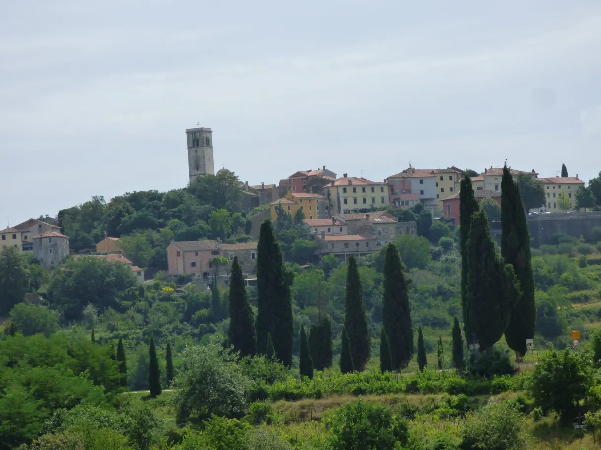 Hilltop village of Oprtalj and its bell tower above the cypresses