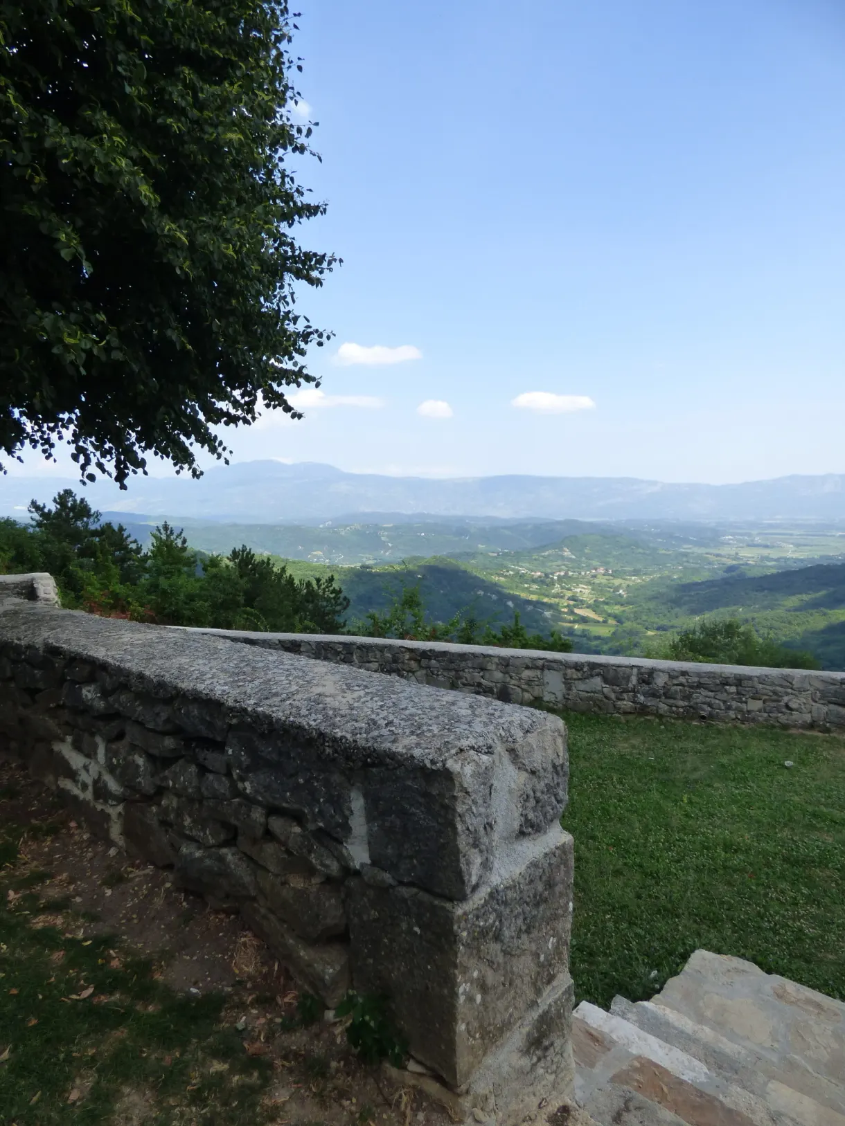 Low stone wall and view over the hills from Gračišće