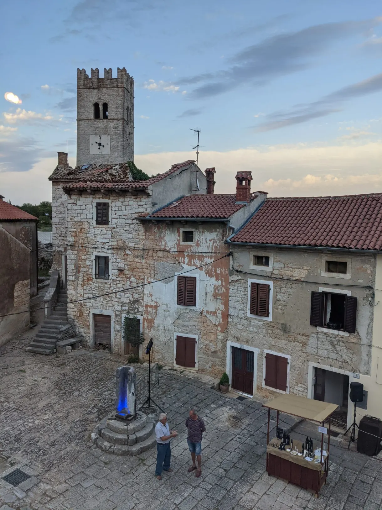 Well and clock tower on the cobbled square of Sveti Lovreč