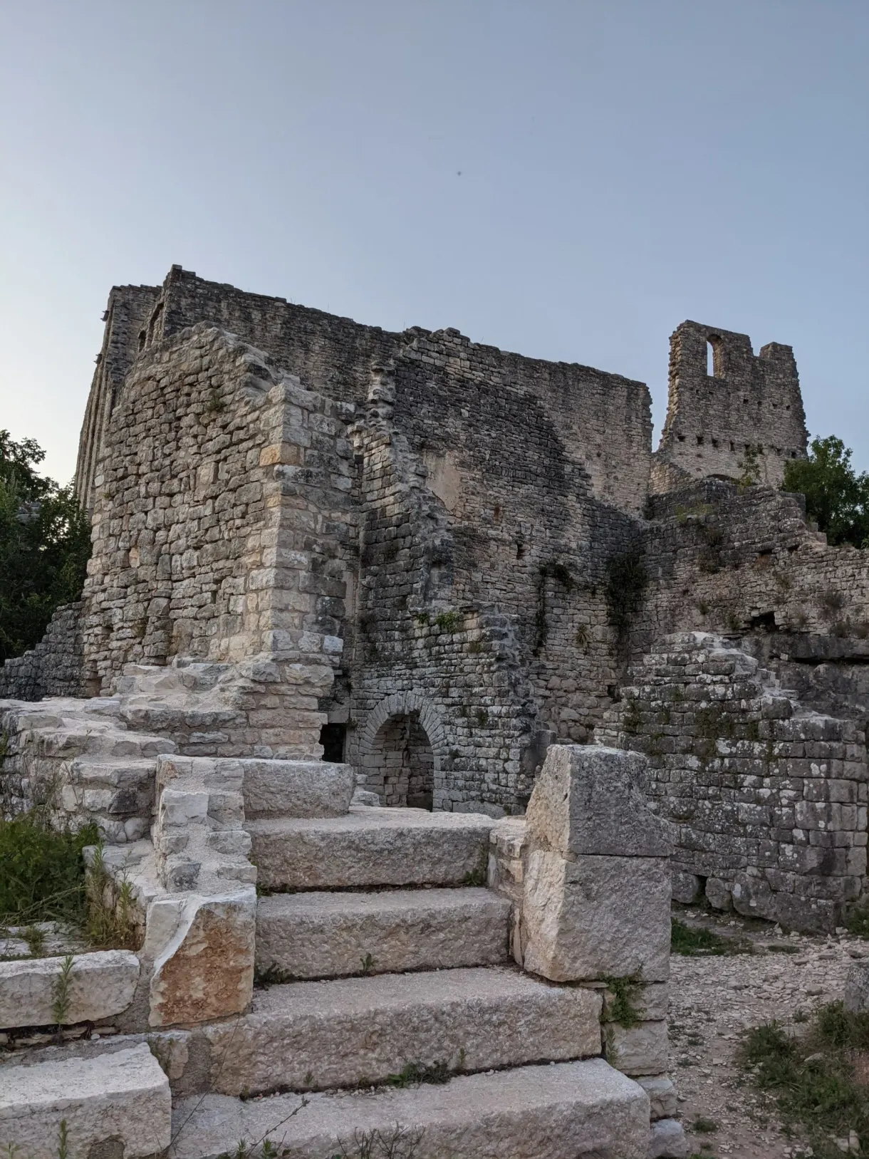 Stone staircase climbing towards the ruined walls of Dvigrad