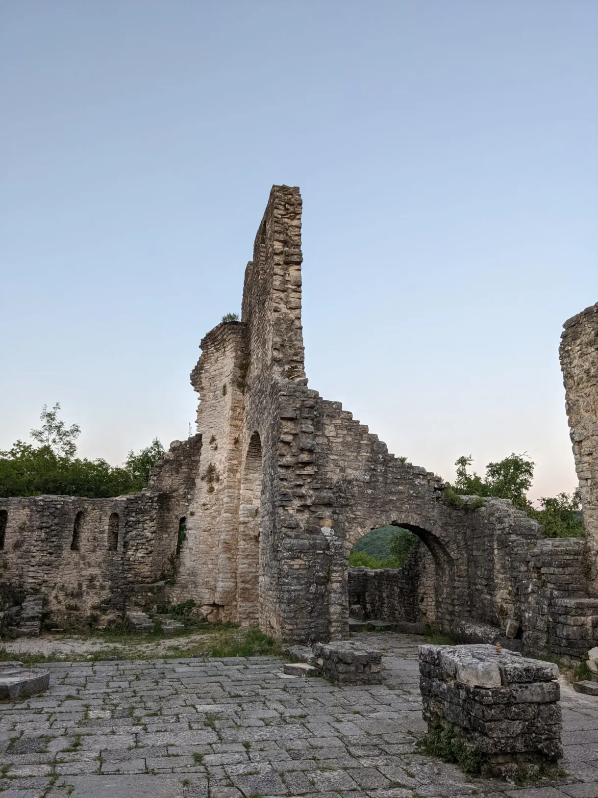 High collapsed wall and stone arch in the ruins of Dvigrad