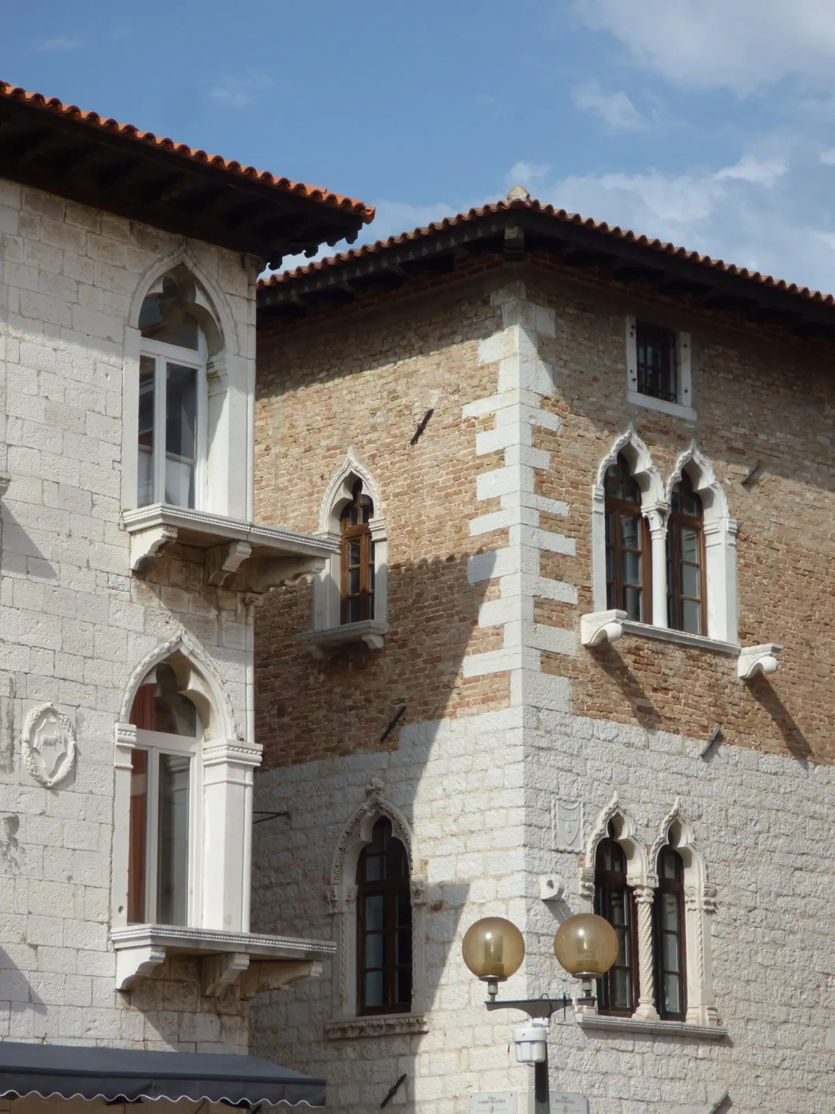 Venetian gothic façade with pointed arch windows in Poreč
