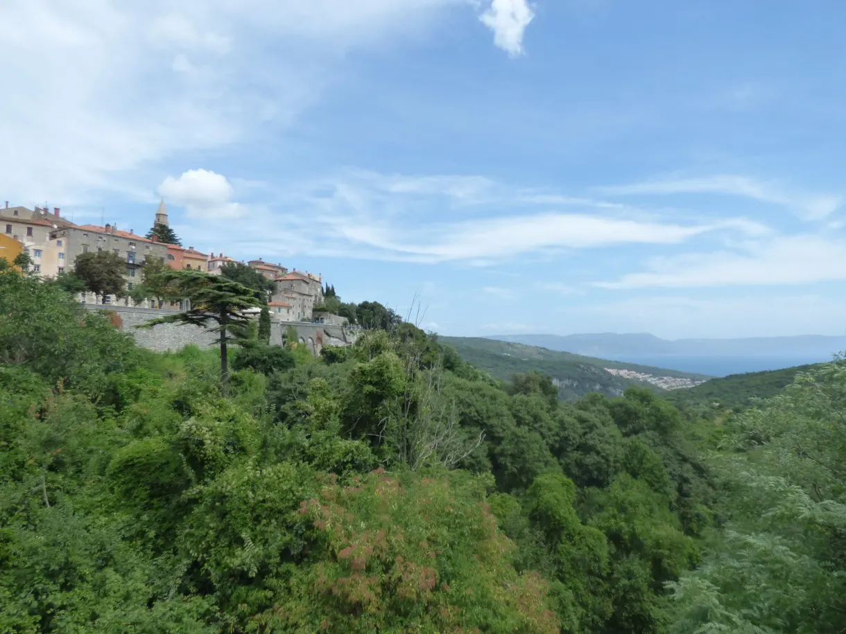 Inhabited ridge of Labin overlooking the bay and the sea in the distance