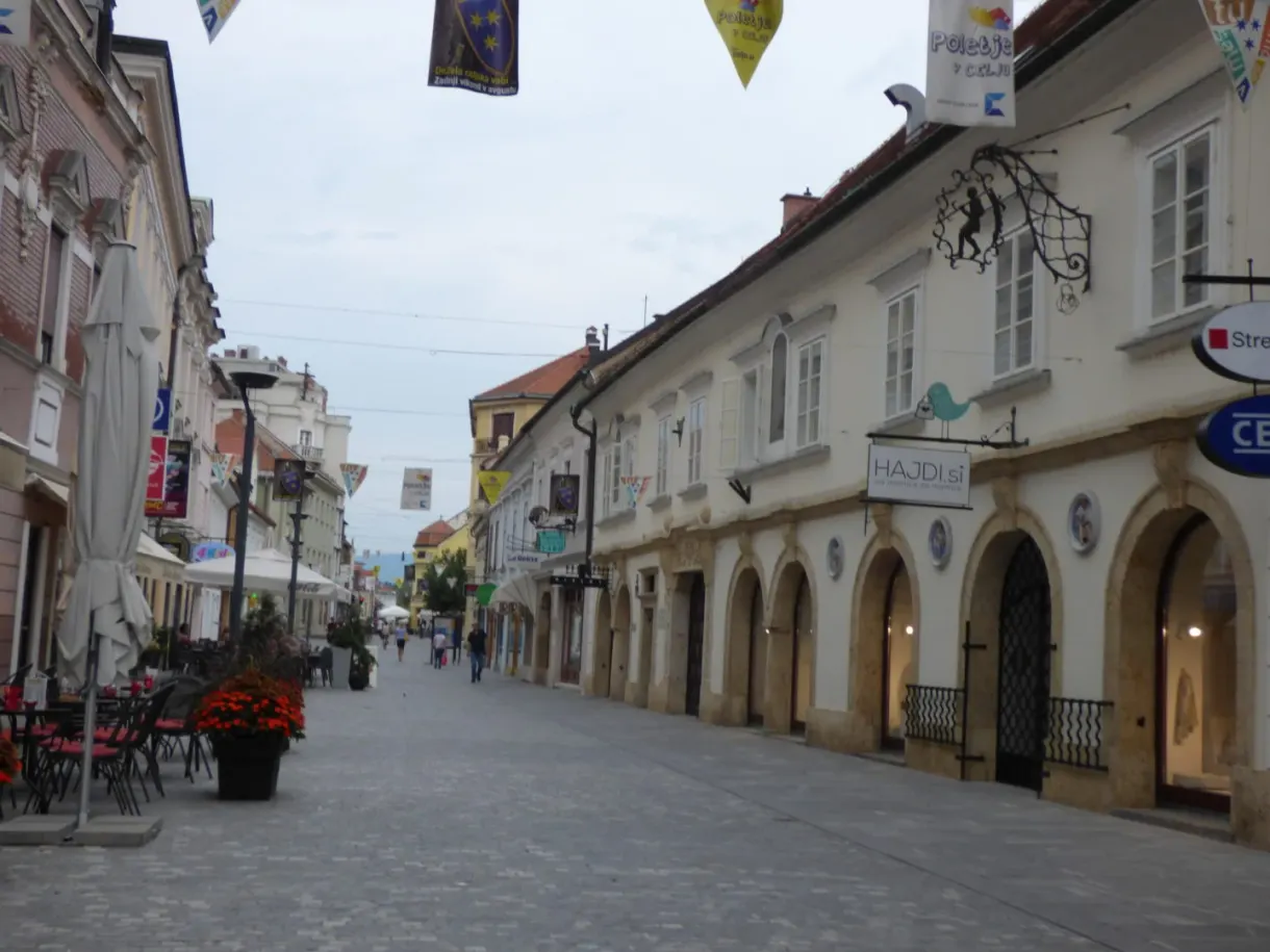 Shopping street lined with arcades and flower-decked terraces