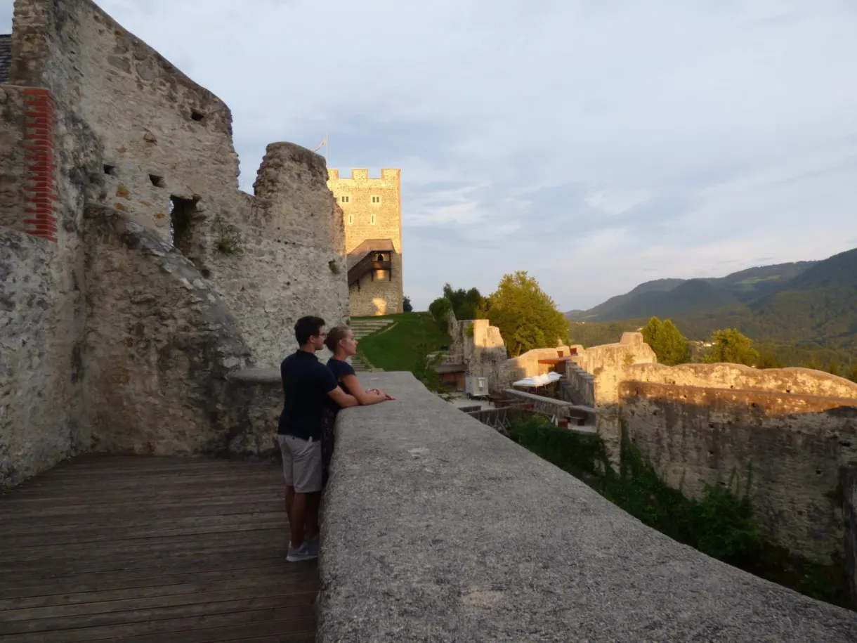 Couple leaning on the wall walk of the ramparts at the end of the day