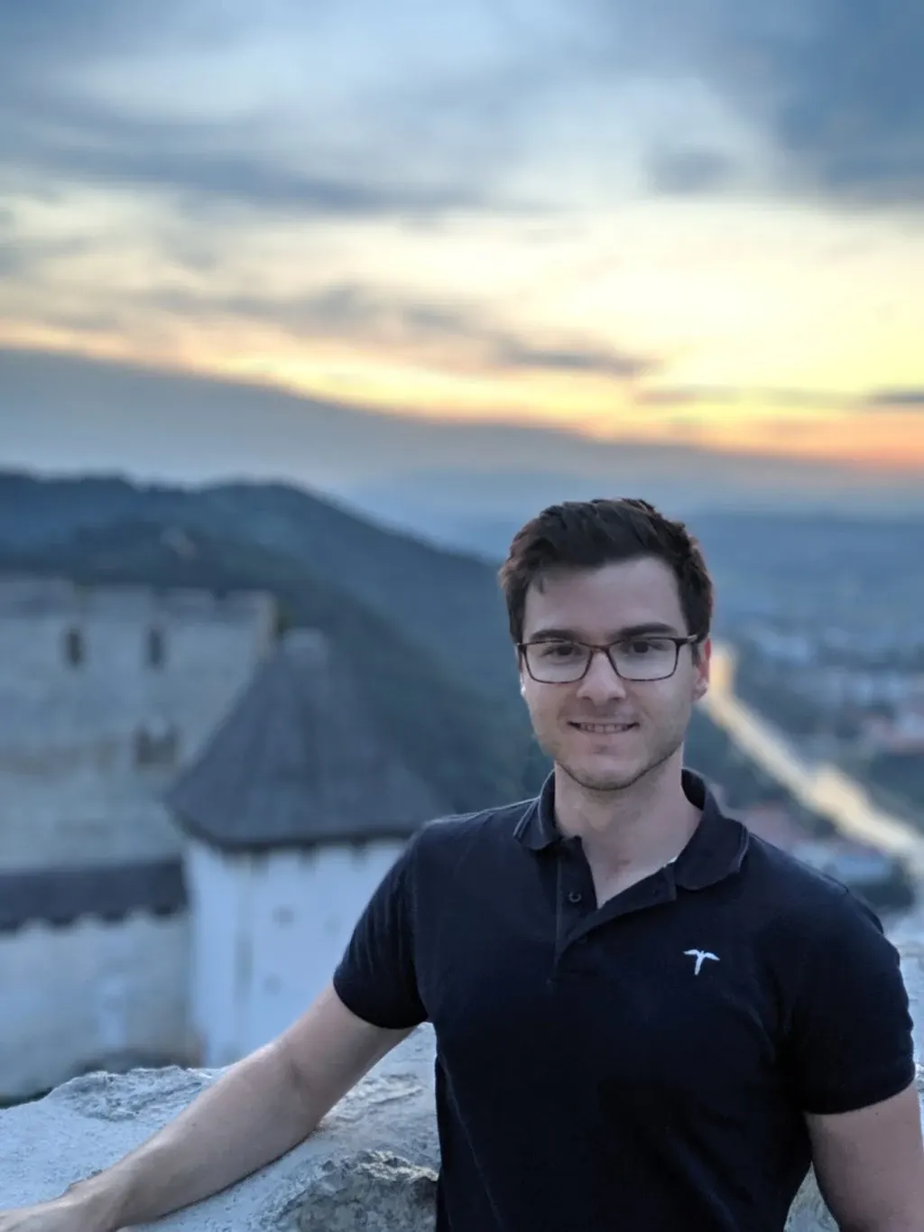 Portrait of a smiling man with the castle in the background