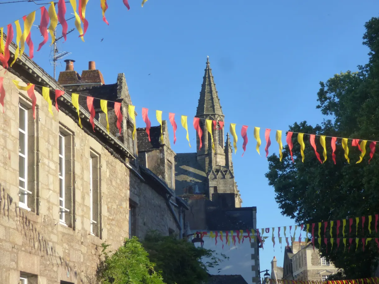 Strings of colourful bunting stretched in front of the church spire
