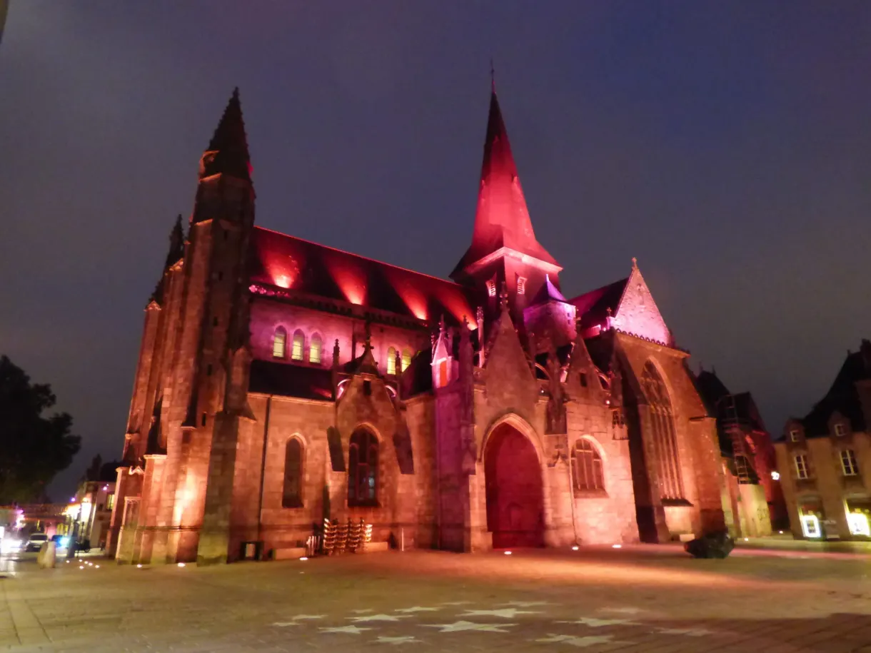 Collegiate church bathed in red and purple in the evening