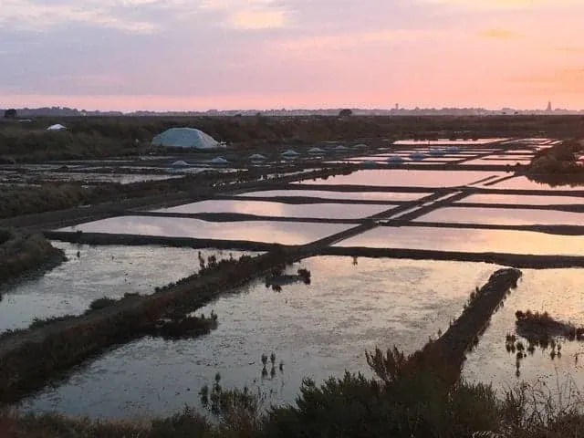 Pink end-of-day sky above the salt pans