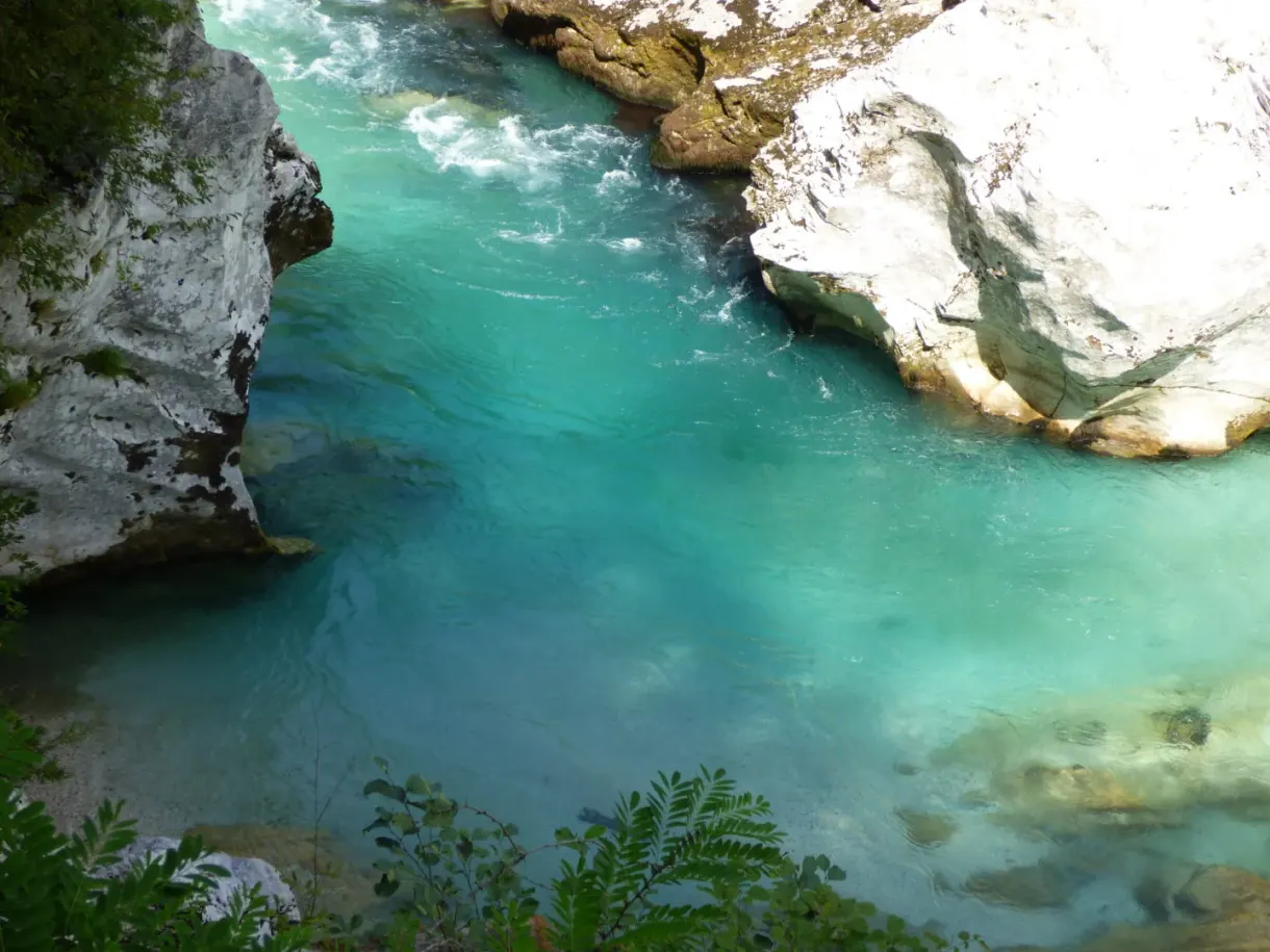 Turquoise water ringed with polished white rocks