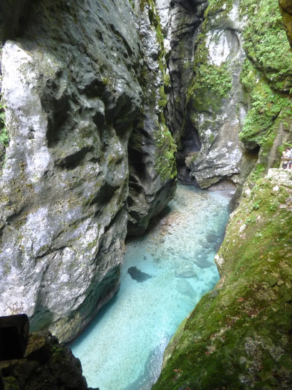 Smooth walls closing in on a trickle of clear water