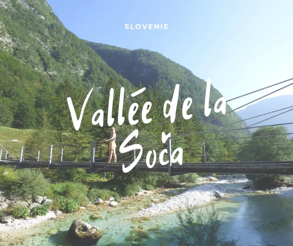 Suspension bridge crossing the Soča at the foot of the mountains