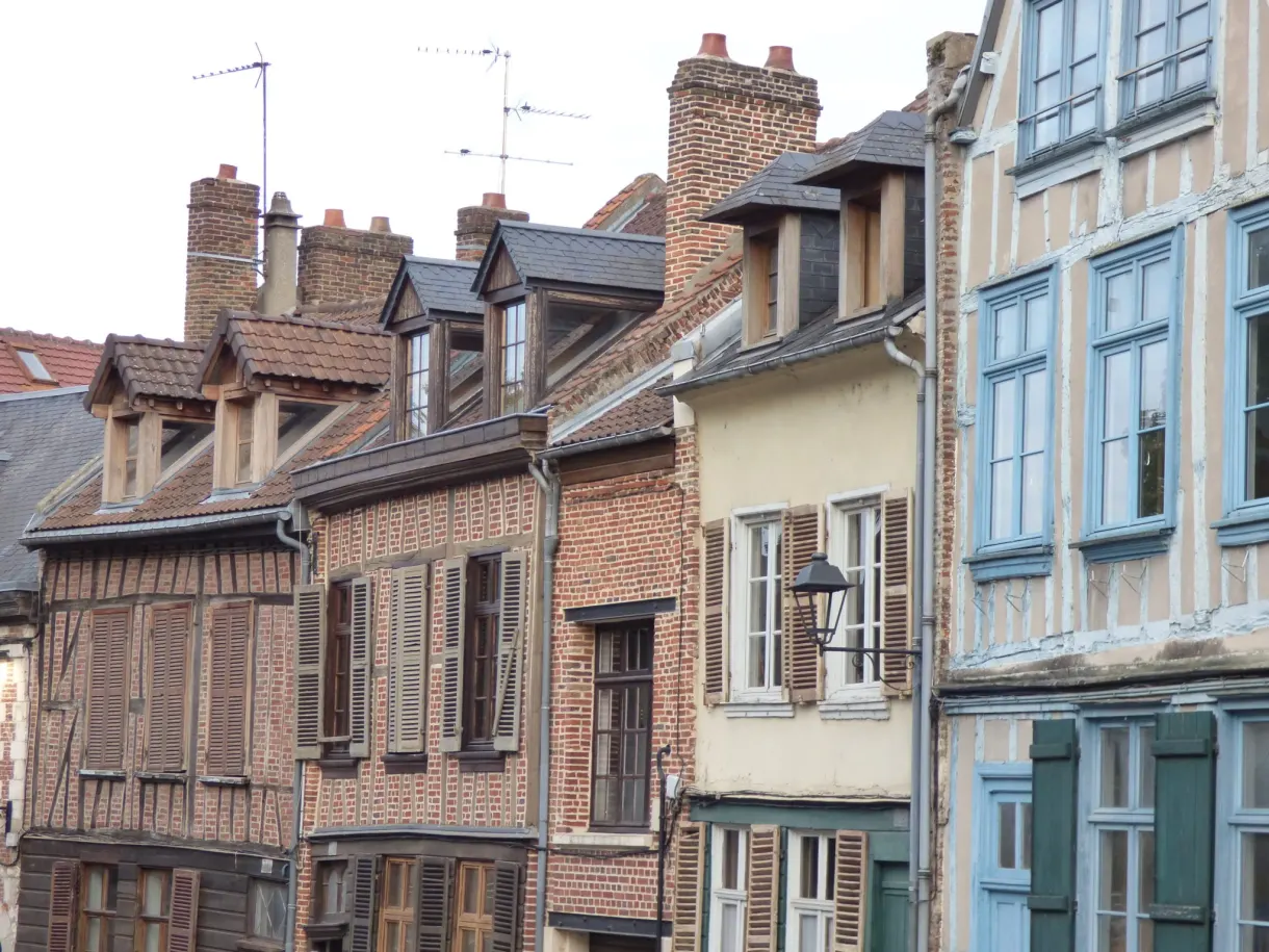 Row of brick and half timbered facades with blue windows