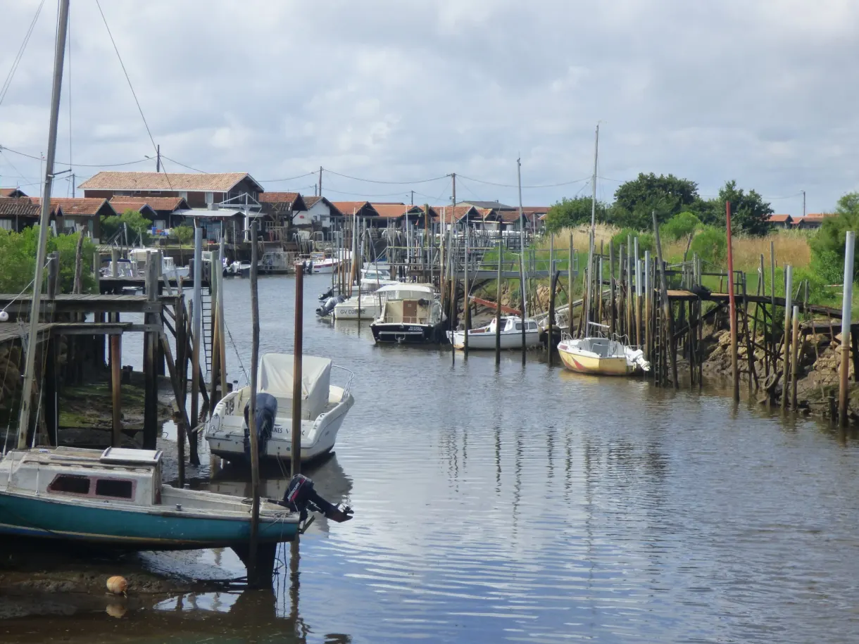 Oyster harbour at low tide, hulls resting on the mud